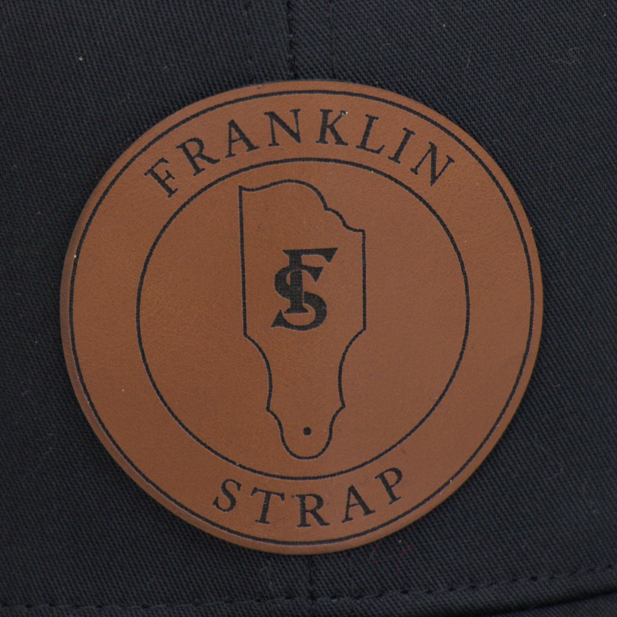 Franklin Strap Black Trucker Hat with Leather Patch | Official Franklin Apparel