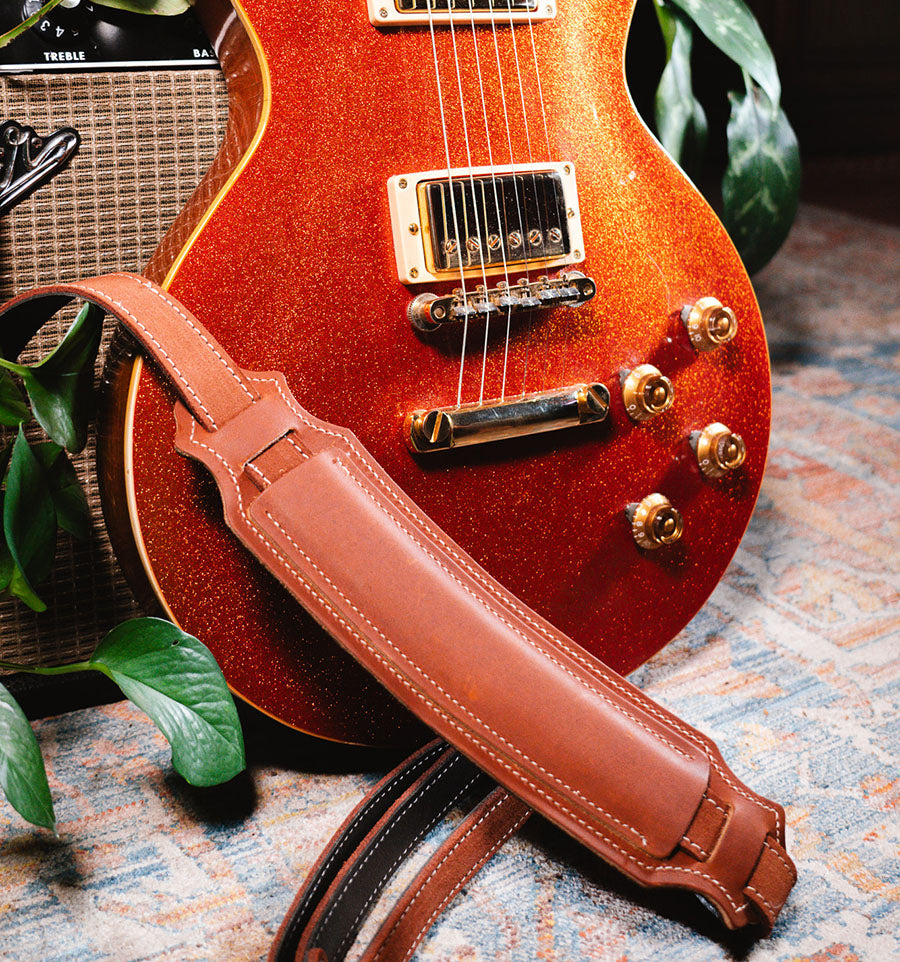 Orange Les paul with leather strap
